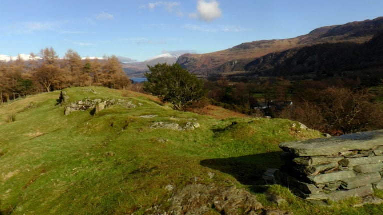 View from an engraved stone seat to fells beyond and Derwent Water in the distance